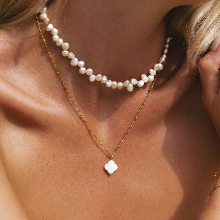 https://cdn.shopify.com/s/files/1/0930/2979/4119/files/white-luck-necklace.jpg?v=1767012414